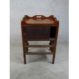 A George III mahogany tambour fronted tray top commode, raised on square tapering supports. H.77 W.