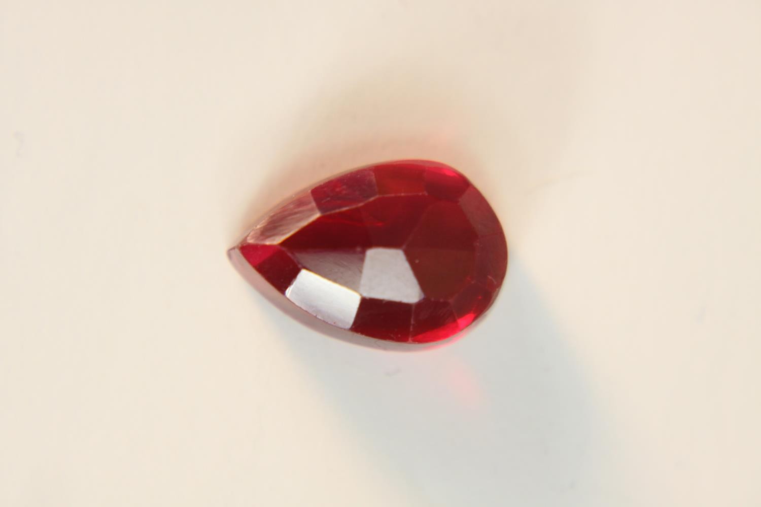 A 12.57 carat mixed cut pear shaped ruby. - Image 5 of 10