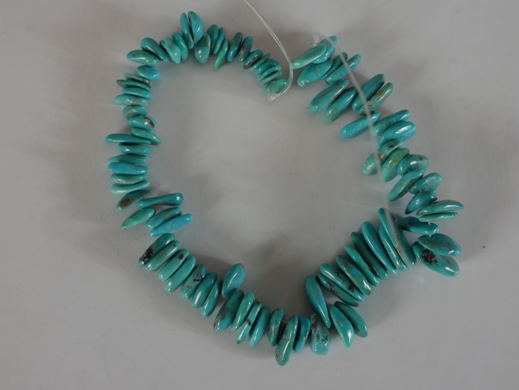 A collection of eight strings of turquoise chips, nuggets and polished round beads. 40cm longest - Image 3 of 7