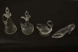 A collection of glass and crystal, including two oil bottles one with an engraved design, a