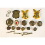 A collection of Danish military badges and uniform buttons, various designs.