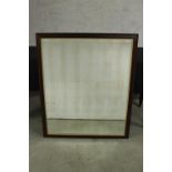 A 20th century stained mahogany rectangular and gilt framed wall hanging mirror. H.101 W.86cm.