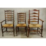 A 19th century mahogany ladder back open arm chair together with a matching single chair and a