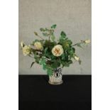 A contemporary Hermes style porcelain cache pot with assorted artificial flowers. H.55cm.