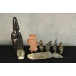 Eight assorted stone figures to include a Mexican clay figure and various Inuit stone carvings. H.