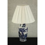 A Chinese porcelain blue and white crackle glaze table lamp decorated with palm 9lamp. H.43cm.