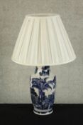 A Chinese porcelain blue and white crackle glaze table lamp decorated with palm 9lamp. H.43cm.
