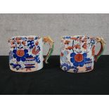 A pair of 19th century English ironstone tankards decorated with floral sprays in the Imari