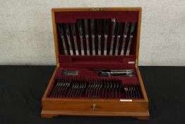 A mid 20th century mahogany canteen of Community silver plated flatware. H.14 W.49 D.34cm.