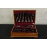 A mid 20th century mahogany canteen of Community silver plated flatware. H.14 W.49 D.34cm.