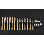 A set of early 20th century silver collared and ivorine handled fish knives and forks, together with