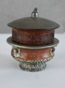 A late 19th/early 20th century Tibetan white metal mounted ritual bowl together with lidded 19th/