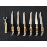 A set of 20th century horn handled pistol grip knives together with matching bottle opener.