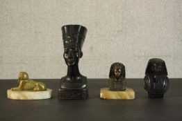 A collection of Egyptian design pieces, including two Art Deco brass and alabaster paperweights