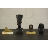 A collection of Egyptian design pieces, including two Art Deco brass and alabaster paperweights