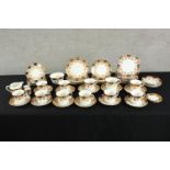 Two 20th century Sutherland China part tea and dinner sets decorated with sprays of flowers, marks