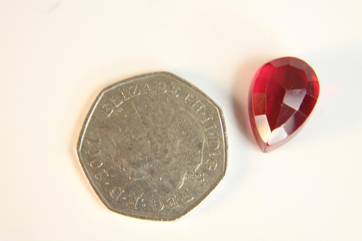 A 12.57 carat mixed cut pear shaped ruby. - Image 2 of 10