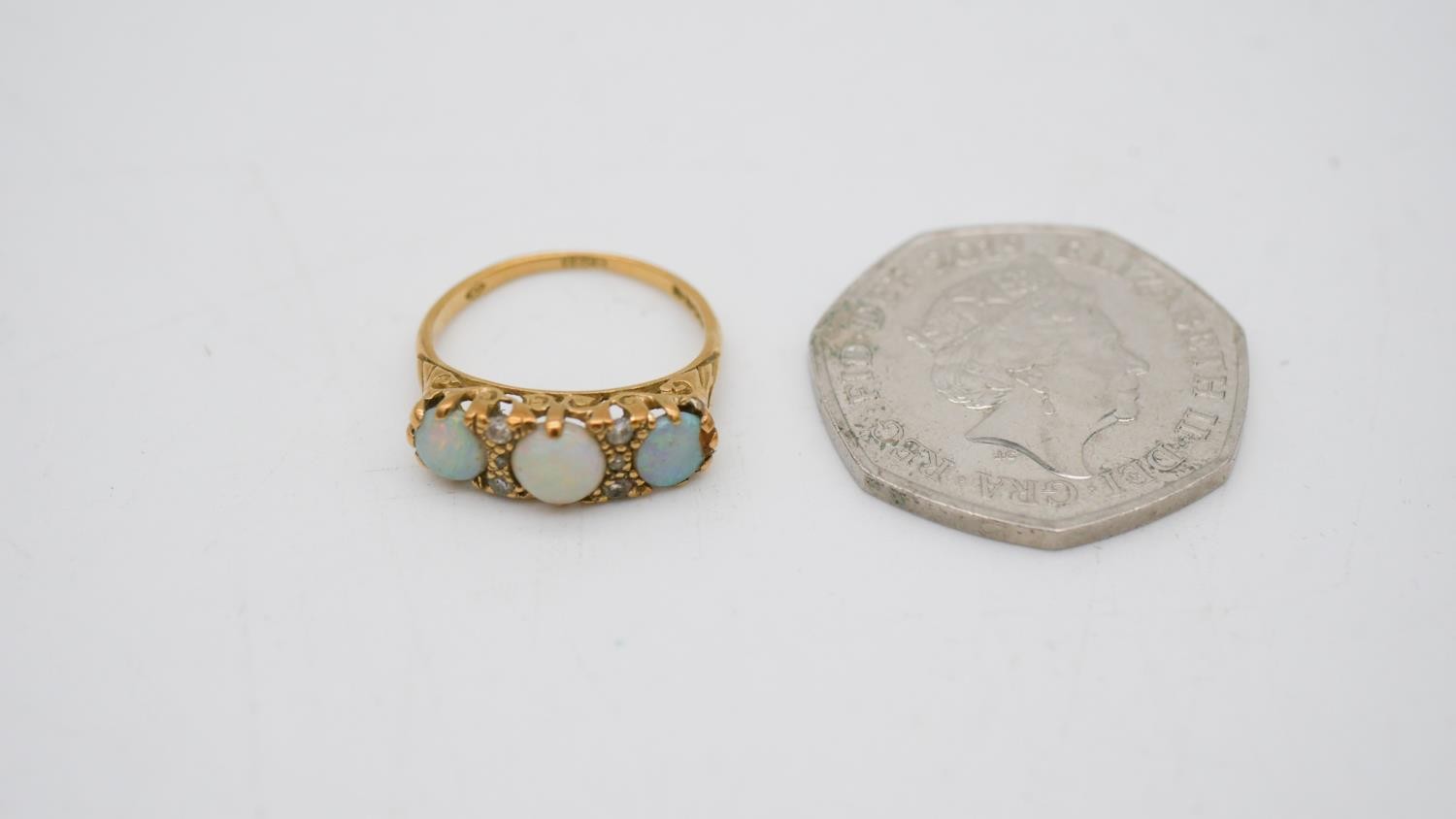 A vintage three stone carved half hoop 18 carat yellow gold opal and diamond ring. Set with three - Image 9 of 9