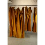Three 20th century gold coloured velvet lined curtains. L.215cm. (each)
