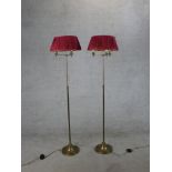 A pair of 20th century brass telescopic floor standing lamps. H.152 W.38 D.38cm