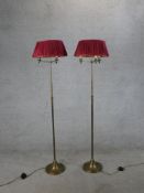 A pair of 20th century brass telescopic floor standing lamps. H.152 W.38 D.38cm