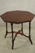 An Edwardian mahogany octagonal occasional table raised on turned and outswept supports. H.59 W.