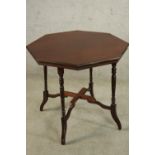 An Edwardian mahogany octagonal occasional table raised on turned and outswept supports. H.59 W.