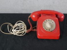 A 20th century red Bakelite electric telephone dial with wind up dial. H.15 W.25 D.22cm