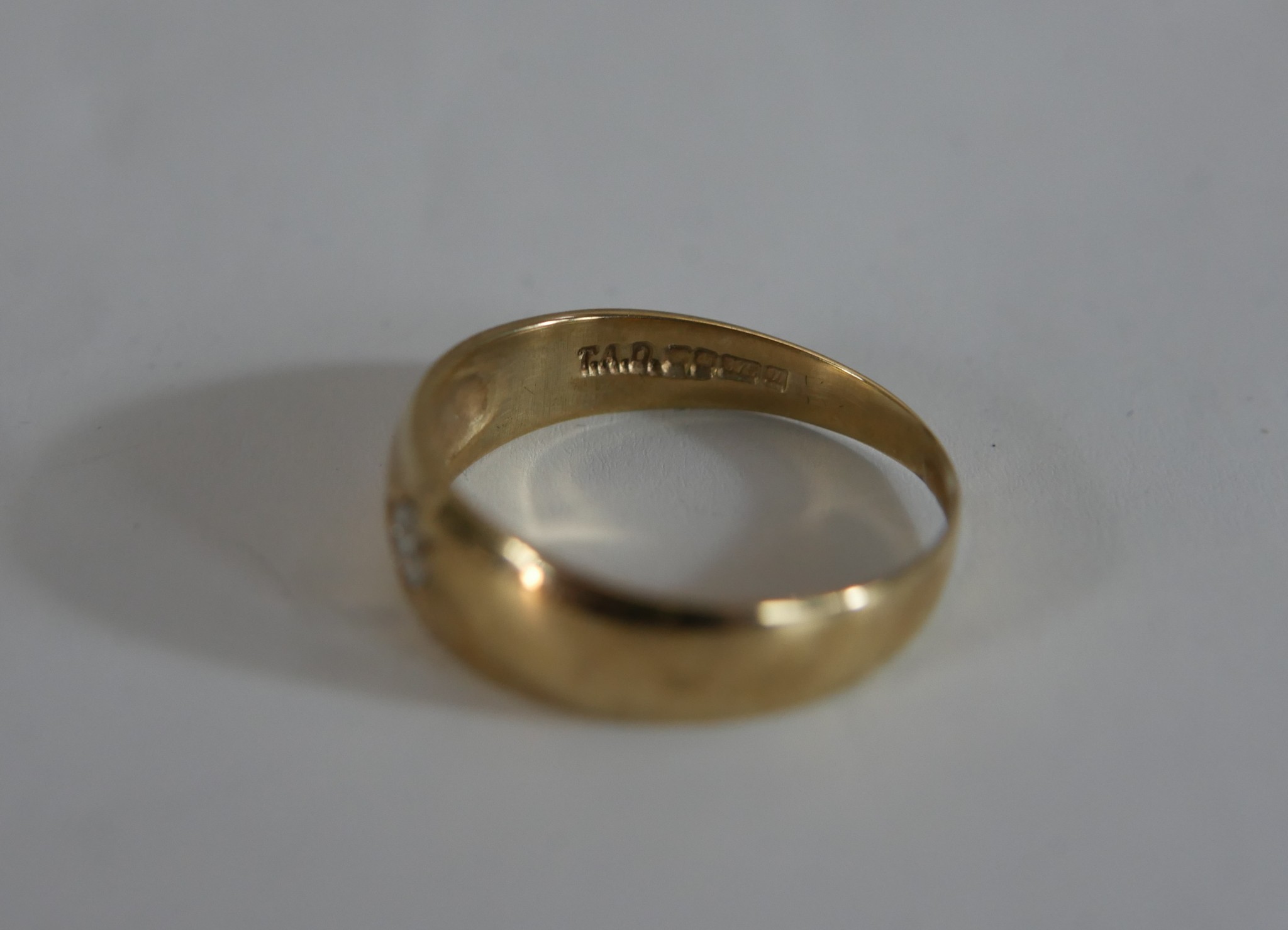 A 9ct gold diamond set band, the eight cut diamond in a star cut setting. Hallmarked:375, Sheffield, - Image 2 of 4
