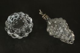 A crystal Orrefors berry design candle holder along with a bunch of grape form bottle with