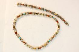 An Art de France gem set magnet circulation bracelet and necklace with certificate. L.14 W.9cm.(box)