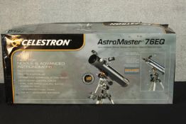 A modern Celestron Astromaster 76EQ telescope complete with instructions. H.27 W.87 D.36cm. (box)