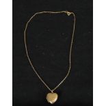 A 9ct back and front engraved gold locket on a 9ct gold trace chain. Clasp stamped 9ct. 4g W.23cm