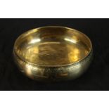 A 20th century Syrian circular brass bowl with engraved geometric pattern. Dia. 19cm.