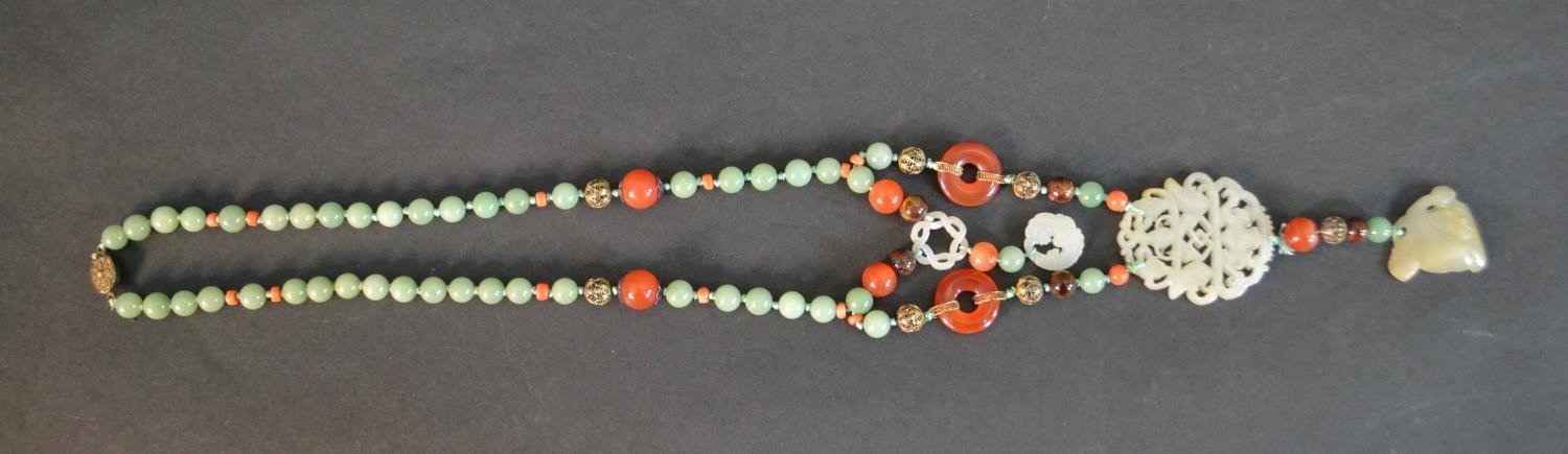 A boxed long ceremonial necklace silver gilt, jade, coral, carnelian and tigers eye pendant - Image 2 of 8