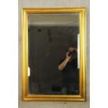 A contemporary rectangular gilt framed mirror. H.100 W.69cm.