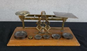 A set of 19th century brass and mahogany postal scales, raised on rectangular plinth base. H.9 W.