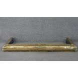 An Arts and crafts style brass fender with applied detailing. (Loose) H.11 W.120 D.39cm