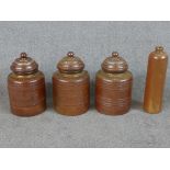 Three 19th century salt glaze Campos Filhos Aveiro pottery lidded storage jars and a similar bottle.