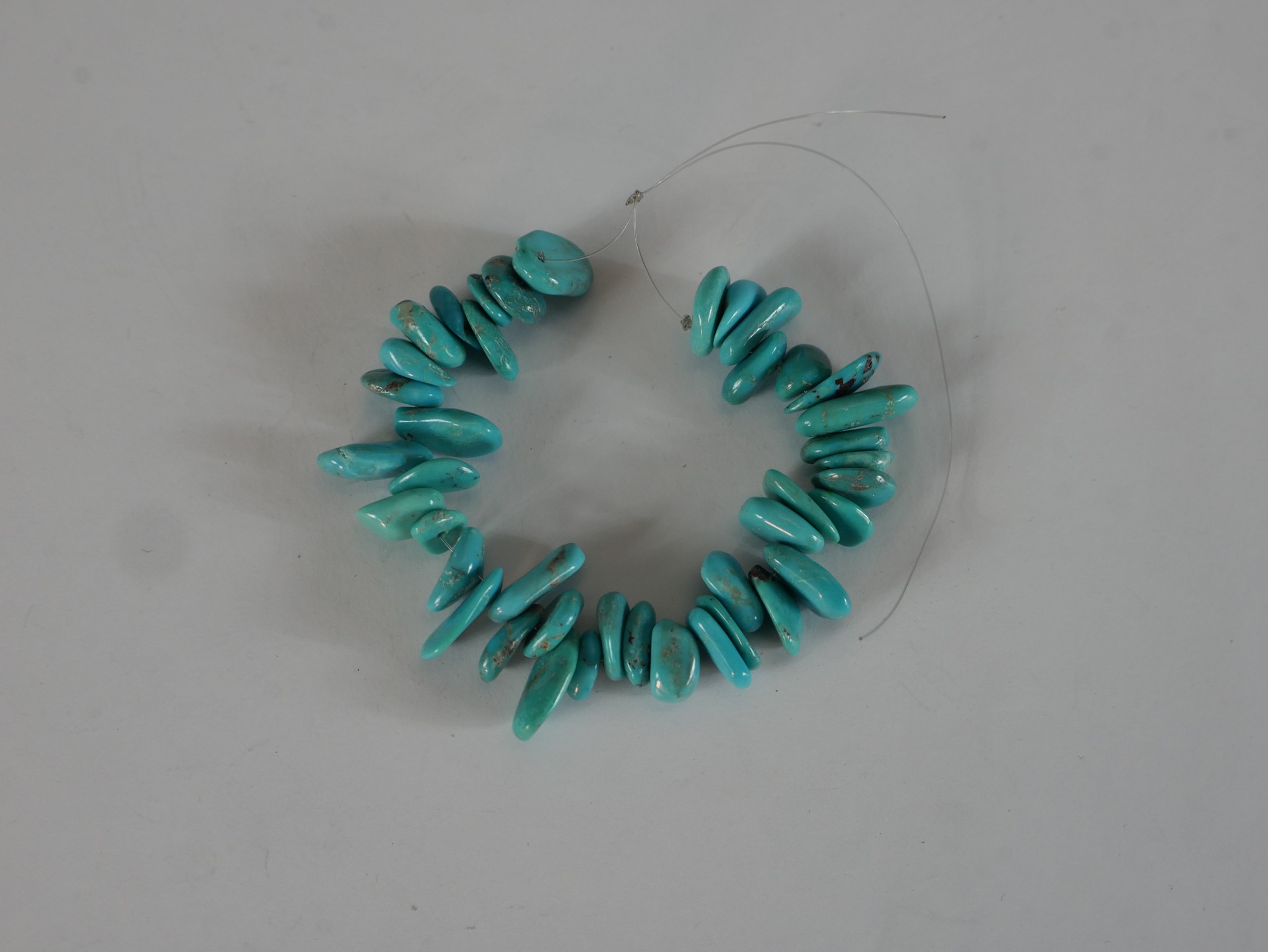 A collection of eight strings of turquoise chips, nuggets and polished round beads. 40cm longest - Image 6 of 7