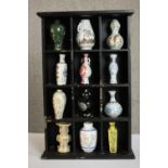 Franklin Mint, a set of twelve miniature Oriental ceramic vases and jars contained within a