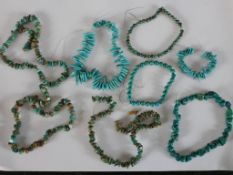 A collection of eight strings of turquoise chips, nuggets and polished round beads. 40cm longest