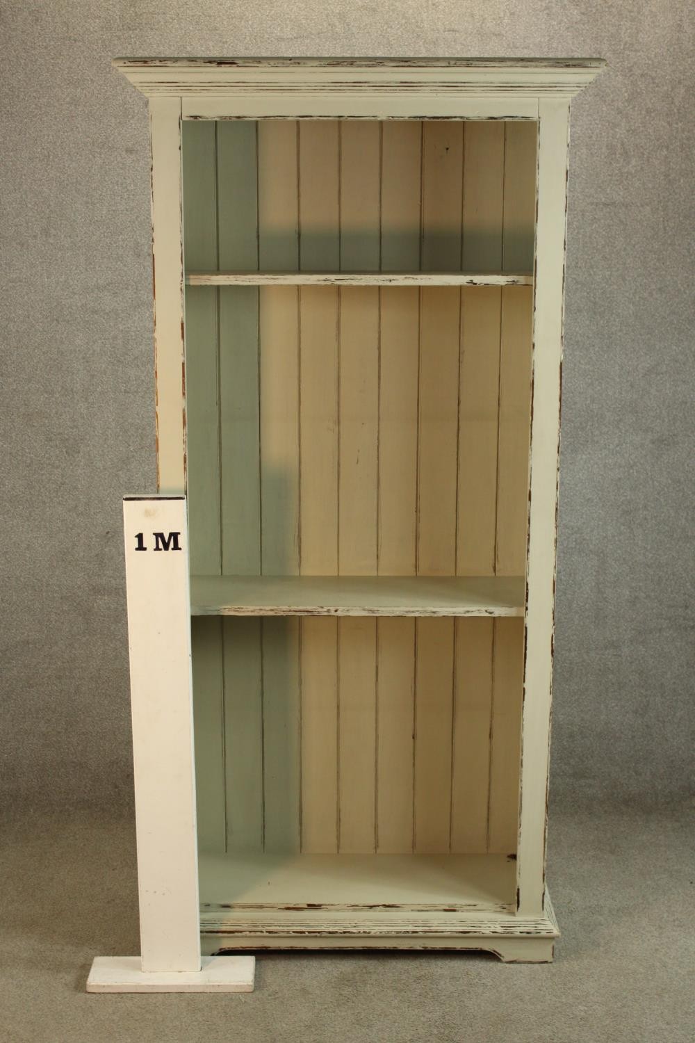 A contemporary painted pine open bookcase raised on shaped bracket feet. H.180 W.90 D.35cm. - Image 2 of 4