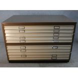 A contemporary metal ten drawer plan chest raised on plinth base. H.94 W.136 D.89cm.