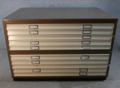A contemporary metal ten drawer plan chest raised on plinth base. H.94 W.136 D.89cm.