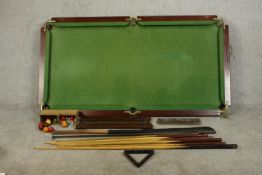 E J Riley Ltd slate bed table top snooker table, with two score boards, six cues and rest and