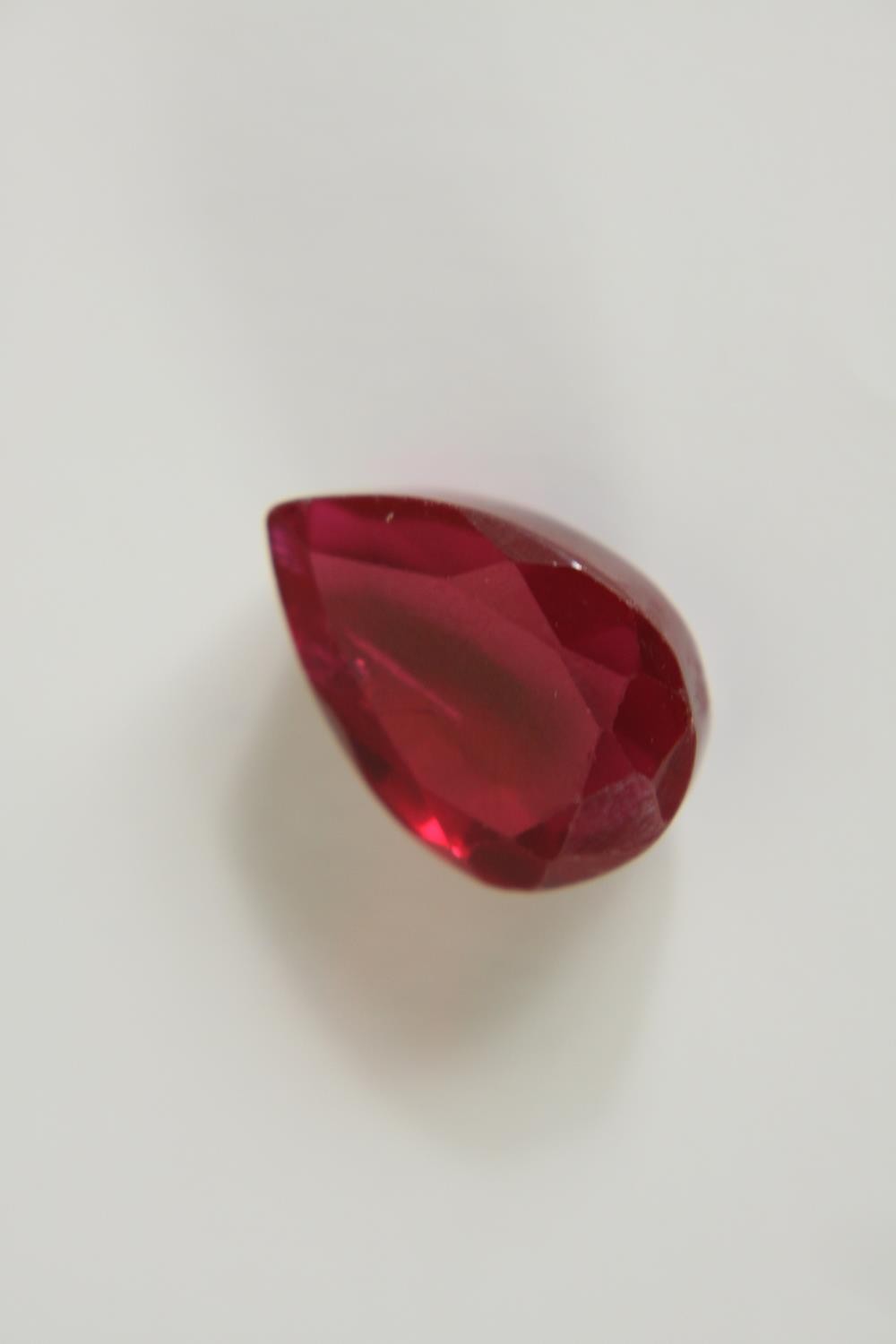 A 12.57 carat mixed cut pear shaped ruby. - Image 3 of 10