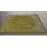 A contemporary large Chinese yellow ground carpet embroidered with floral decoration. L.365 W.265cm.