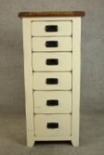 A contemporary painted pine tallboy six graduating drawers with iron swing handles. H.118 W.53 D.