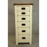 A contemporary painted pine tallboy six graduating drawers with iron swing handles. H.118 W.53 D.